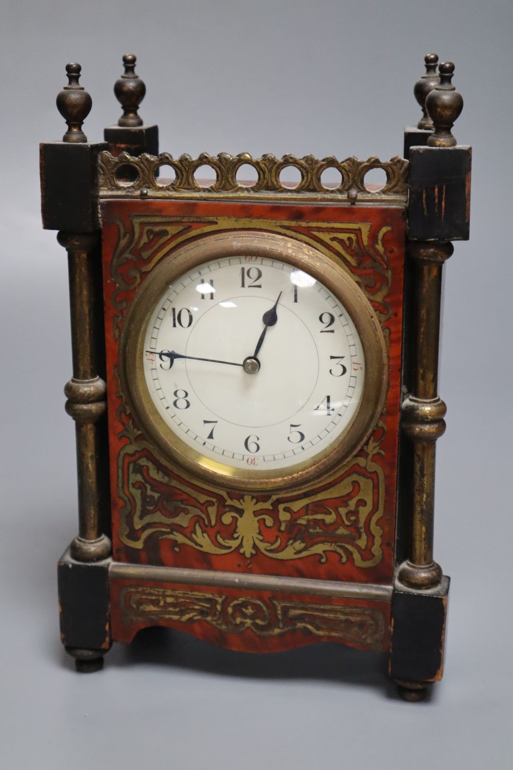 A small 19th century French timepiece, of rectangular form with ebonised and boulle work case and gilt brass mounts, integral key, heig